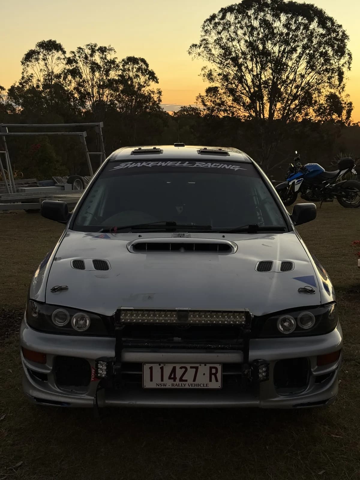 The Shakewell Racing Subaru Impreza with its LED light bar at dusk before the night stages of the Classic Queensland Rally 2026